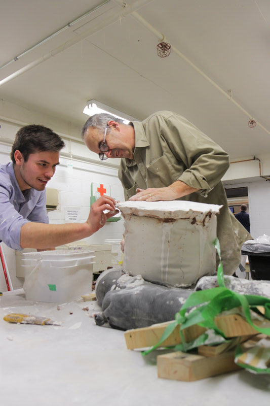glen mackinnon and student working on sculpture