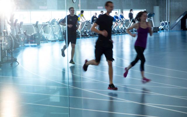 People running on indoor track