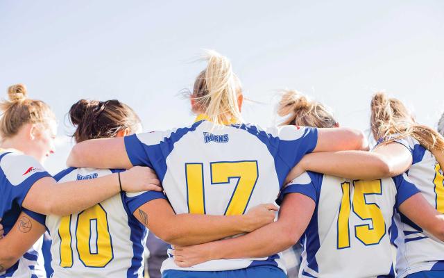 Rugby players in huddle