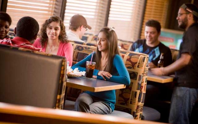 Students sitting at The Zoo, the campus pub