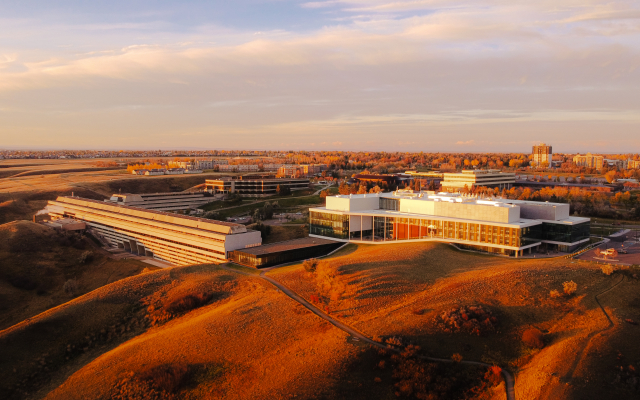 Drone shot of the university of Lethbridge main campus on a warm, orange, fall day