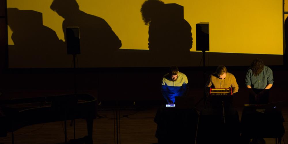 students performing electroacoustic music in the recital hall