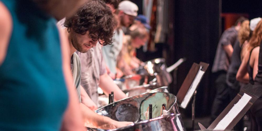 closeup of student playing steel drum