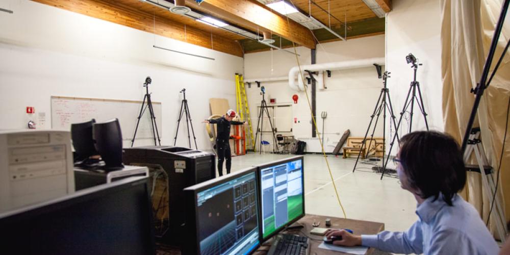 wide shot of motion capture area and computers