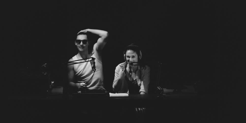 black and white image of two students looking at camera