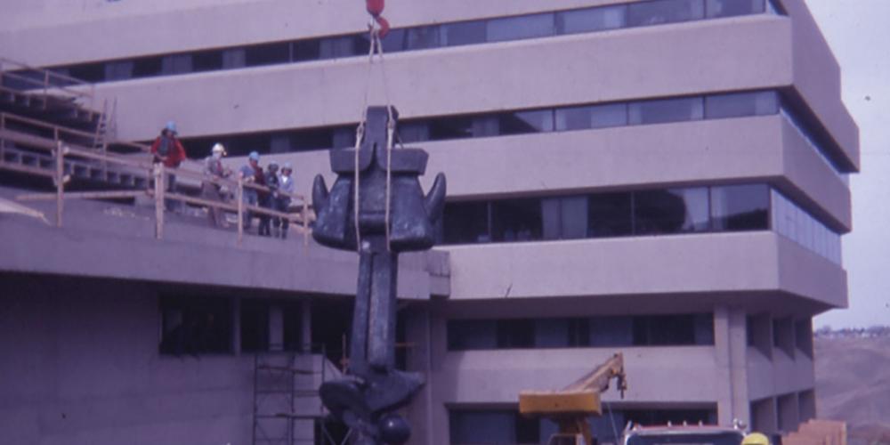 Moses sculpture being lifted by a crane