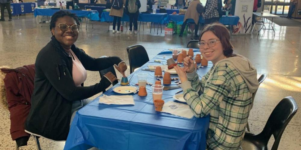 Students Painting Vegetable Garden Pots