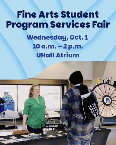 A student chatting with a WIL instructor at the Fine Arts Student Program Services Fair.